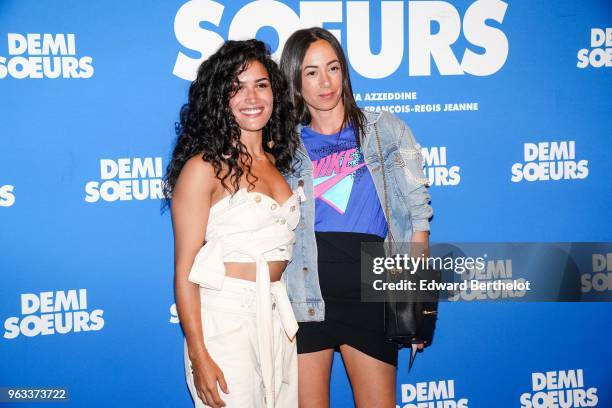 Sabrina Ouazani and Janane Boudili attend the "Demi Soeurs" Paris Premiere photocall, at Mk2 Bibliotheque on May 28, 2018 in Paris, France.