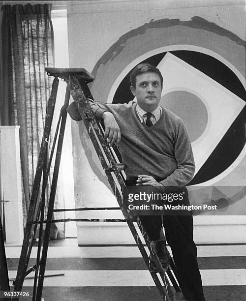 Artist Kenneth Noland poses before one of his eight-by-eight-foot paintings, "Split," which is one of his "monumental" works on exhibit at the...