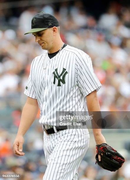 Cole of the New York Yankees heads to the dugout in the seventh inning against the Houston Astros at Yankee Stadium on May 28, 2018 in the Bronx...