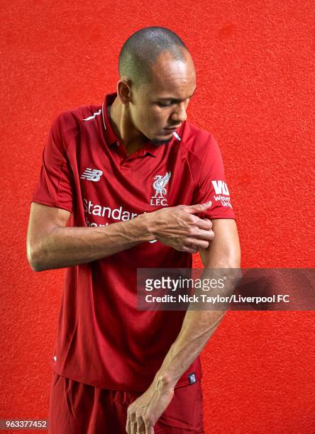 Fabinho signs for Liverpool Football Club at Melwood Training Ground on May 28, 2018 in Liverpool, England.