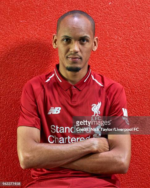 Fabinho signs for Liverpool Football Club at Melwood Training Ground on May 28, 2018 in Liverpool, England.