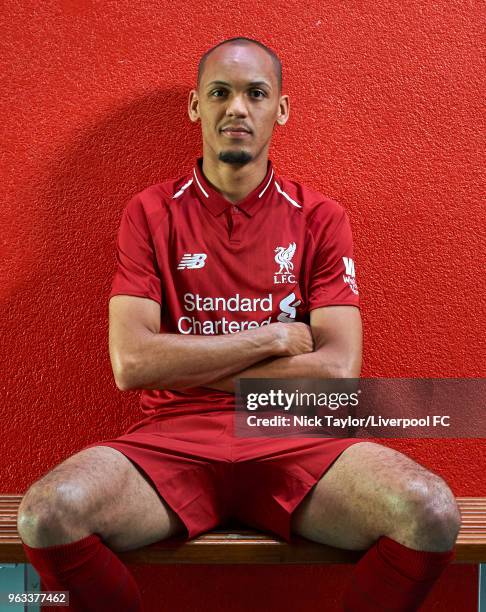 Fabinho signs for Liverpool Football Club at Melwood Training Ground on May 28, 2018 in Liverpool, England.