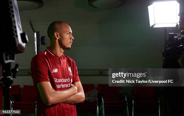 Fabinho signs for Liverpool Football Club at Melwood Training Ground on May 28, 2018 in Liverpool, England.