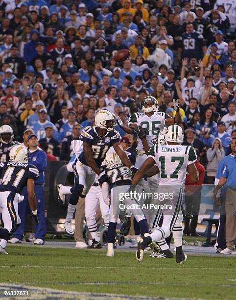 Safety Kerry Rhodes of the New York Jets recovers an onsides kick against the San Diego Chargers when the Chargers host the Jets in the Divisional...