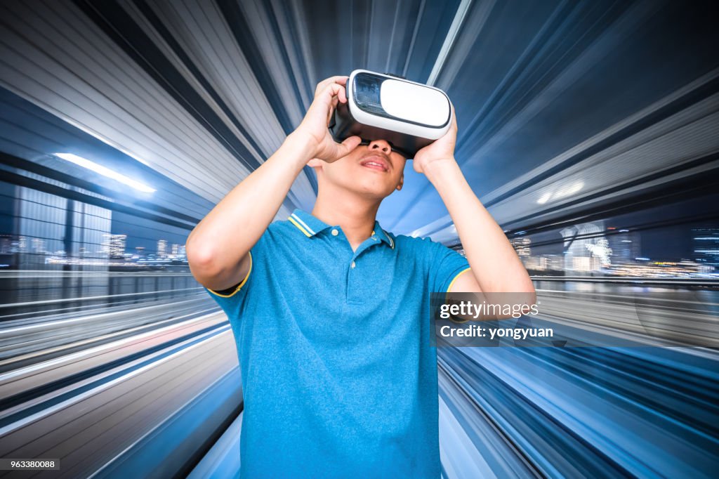 Young man using a virtual reality simulator headset