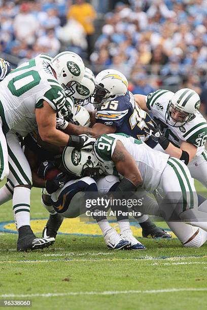 Linebacker Calvin Pace of the New York Jets makes a stop against the San Diego Chargers when the Chargers host the Jets in the Divisional Playoffs at...