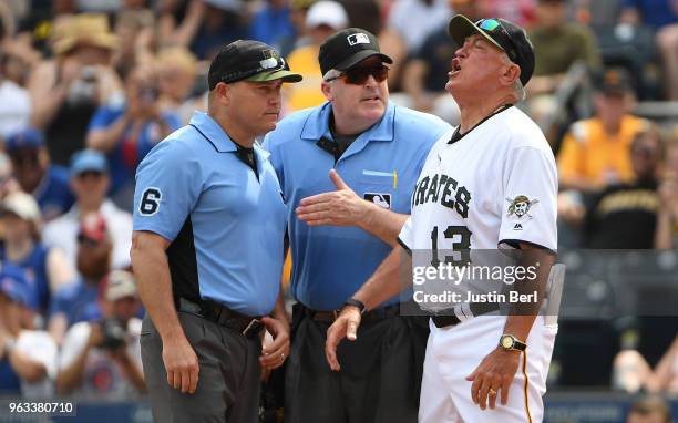 Clint Hurdle of the Pittsburgh Pirates argues with umpires Mark Carlson and Bill Welke after he was ejected in the eighth inning during the game...