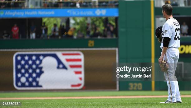 David Freese of the Pittsburgh Pirates stands for a moment of silence in the sixth inning during the game against the Chicago Cubs at PNC Park on May...