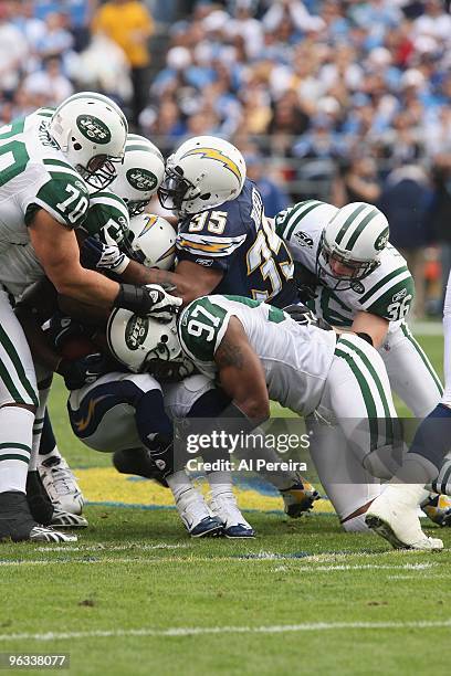 Linebacker Calvin Pace of the New York Jets makes a stop against the San Diego Chargers when the Chargers host the Jets in the Divisional Playoffs at...