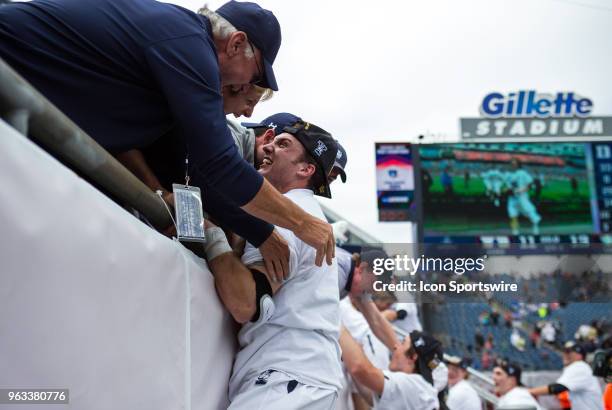 Yale Bulldogs players celebrate with fans at the conclusion of the NCAA Division I Men's Championship match between Duke Blue Devils and Yale...