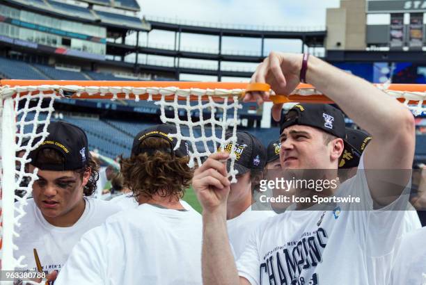 Yale Bulldogs players cut the net at the conclusion of the NCAA Division I Men's Championship match between Duke Blue Devils and Yale Bulldogs on May...