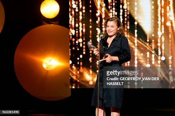 French actress Blanche Gardin holds her trophy after winning a Moliere award for best humor in "Je parle toute seule" during the 30th Molieres French...
