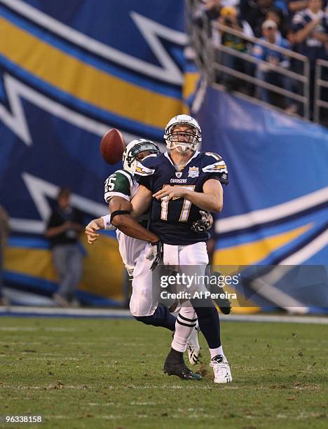Safety Kerry Rhodes of the New York Jets has a strip sack of Quarterback Phillip Rivers of the San Diego Chargers when the Chargers host the Jets in...
