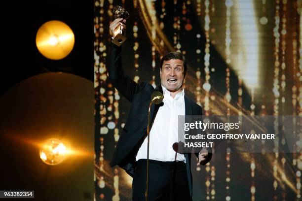 French actor Franck Desmedt holds his trophy after winning a Moliere award for best actor in a second role in "Adieu Monsieur Haffmann" during the...