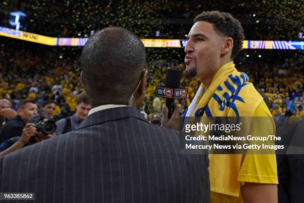 Golden State Warriors' Klay Thompson smiles while being interviewed after defeating the Houston Rockets during Game 6 of the NBA Western Conference...