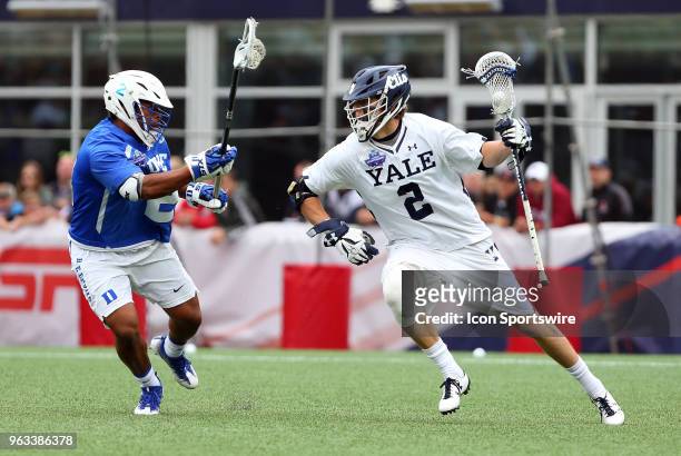 Yale Bulldogs attackman Ben Reeves and Duke Blue Devils defender JT Giles-Harris during the NCAA Division I Men's Championship match between Duke...
