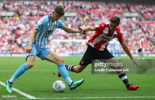 Tom Bayliss of Coventry City and Craig Woodman of Exeter City during the Sky Bet League Two Play Off Final between Coventry City and Exeter City at...