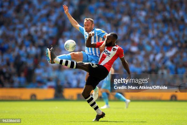 Liam Kelly of Coventry City in action with Hiram Boateng of Exeter City during the Sky Bet League Two Play Off Final between Coventry City and Exeter...