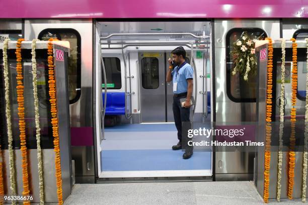 Delhi Metro official is seen on the Magenta Metro after the 25.6 kilometre long Janakpuri West-Kalkaji Mandir Metro corridor was flagged off by the...