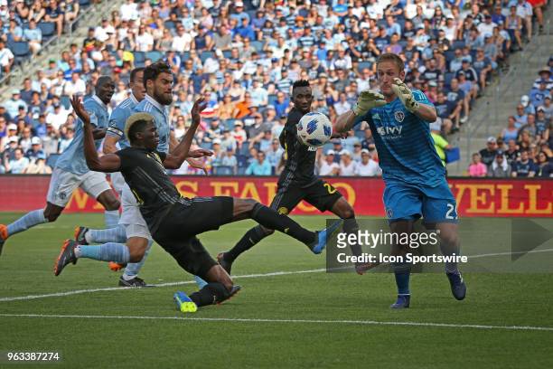 Sporting Kansas City goalkeeper Tim Melia comes off his line to make a save against Columbus Crew forward Gyasi Zerdes in the first half of an MLS...