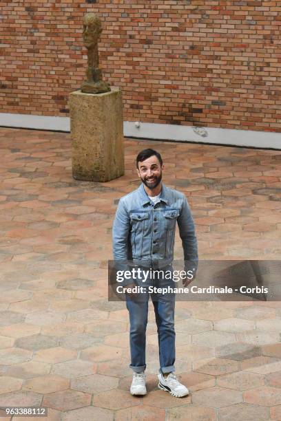 Designer Nicolas Ghesquiere acknowledges the applause of the audience after the Louis Vuitton 2019 Cruise Collection at Fondation Maeght on May 28,...