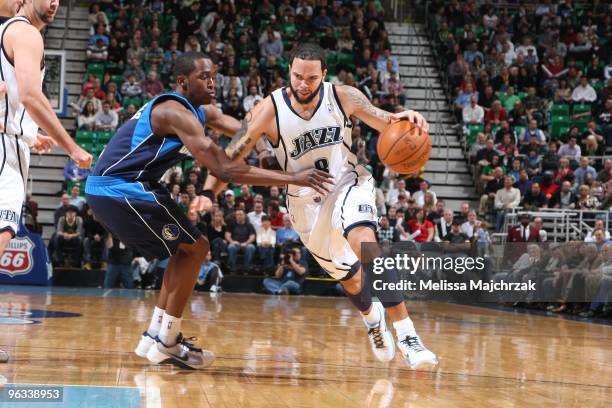Deron Williams of the Utah Jazz drives to the basket past Rodrique Beaubois of the Dallas Mavericks at EnergySolutions Arena on February 1, 2010 in...