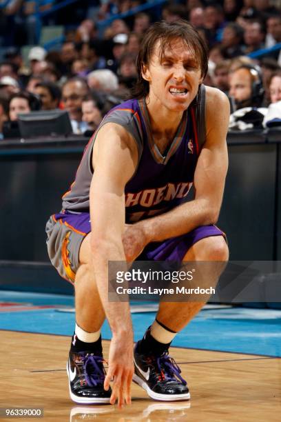 Steve Nash of the Phoenix Suns grimaces in pain after hurting his knee against the New Orleans Hornets on February 1, 2010 at the New Orleans Arena...