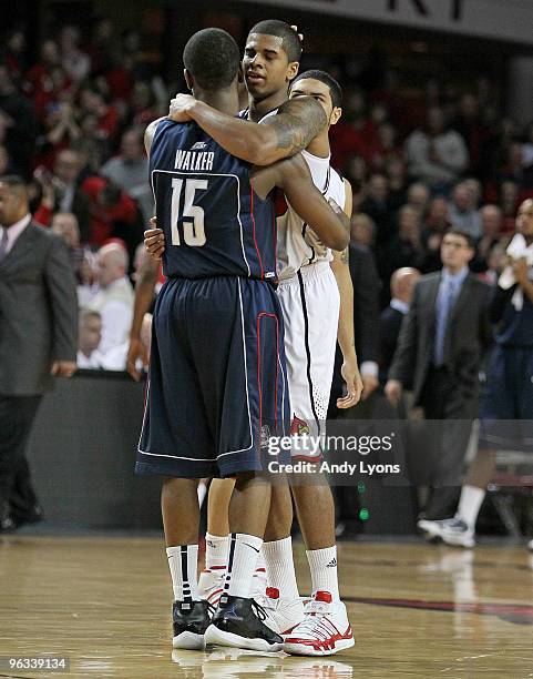 Edgar Sosa of the Louisville Cardinals and Kemba Walker of the Connecticut Huskies embrace following the Big East Conference game on February 1, 2010...