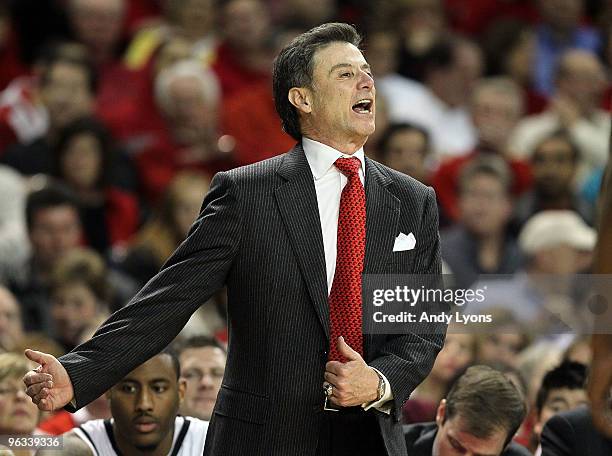 Rick Pitino the Head Coach of the Louisville Cardinals gives instructions to his team during the Big East Conference game against the Connecticut...