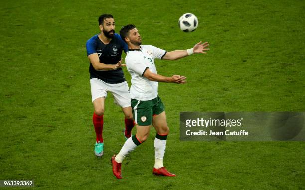 Shane Long of Ireland, Adil Rami of France during the international friendly match between France and Republic of Ireland at Stade de France on May...