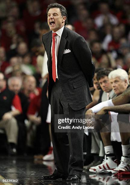 Rick Pitino the Head Coach of the Louisville Cardinals gives instructions to his team during the Big East Conference game against the Connecticut...