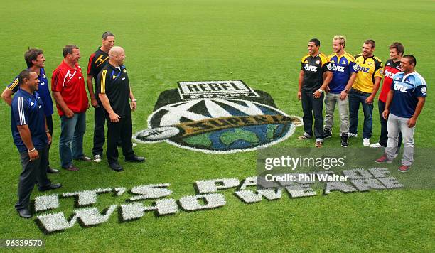 Original Super Rugby players Ofisa Tonu�u, John Lesley, Richard Loe, Mark Allen, and Ian Jones stand with current Super 14 captains Mils Muliaina of...