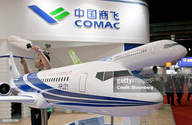 Models of the Commercial Aircraft Corp. Of China ARJ21, left, and C919 airplanes are displayed at the Singapore Airshow, in Singapore, on Tuesday,...