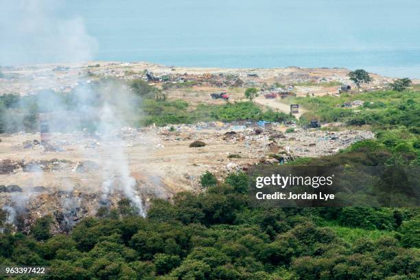 land of garbage dump - pressmaschine stock-fotos und bilder