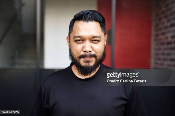 portrait of a young hipster malay man - handsome muslim men stock pictures, royalty-free photos & images