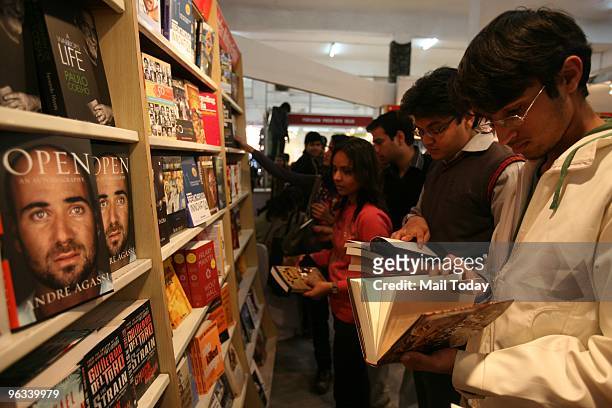 Book lovers have a look at the books on display on the opening day of the World Book Fair in New Delhi on Saturday, January 30, 2010.