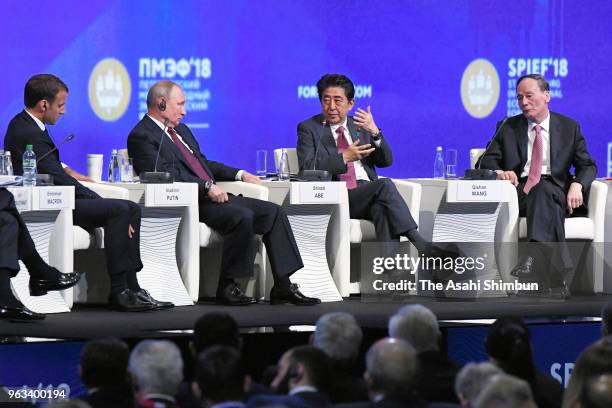 French President Emmanuel Macron, Russian President Vladimir Putin, Japanese Prime Minister Shinzo Abe and Chinese Vice President Wang Qishan attend...