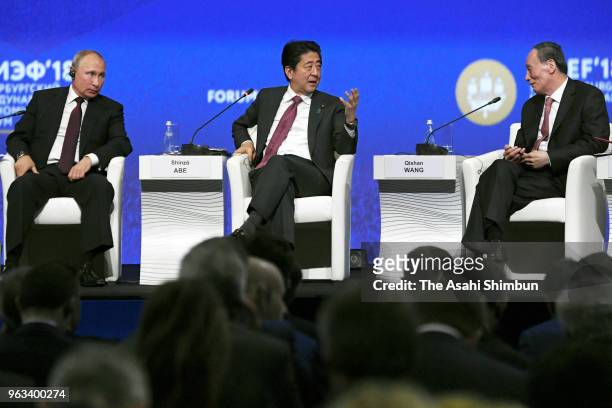 Russian President Vladimir Putin, Japanese Prime Minister Shinzo Abe and Chinese Vice President Wang Qishan attend the St. Petersburg International...