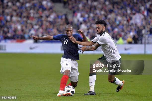 Djibril Sidibe of France and Derrick Williams of Republic of Ireland fight for the ball during the international friendly match between France and...