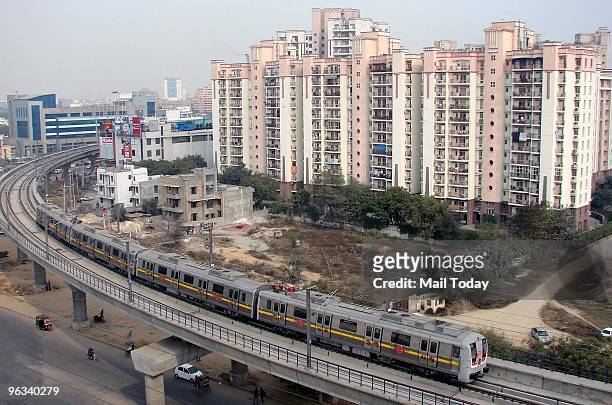 Metro train can be seen during a trial run on an elevated section in Gurgaon around 30 km from New Delhi on Friday, January 29, 2010.