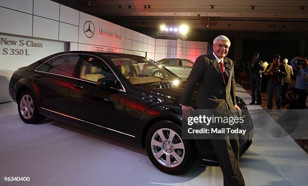 Dr. Wilfred G. Aulbur, MD '& ' CEO, Mercedes-Benz India, poses next to the new S 350 Mercedes at its launch in Delhi on January 28, 2010.