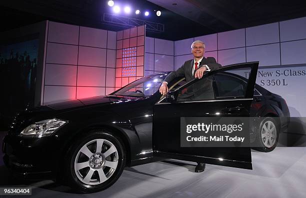 Dr. Wilfred G. Aulbur, MD '& ' CEO, Mercedes-Benz India, poses next to the new S 350 Mercedes at its launch in Delhi on January 28, 2010.