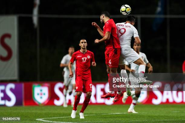 Tunisia defender Yassine Meriah vies with Portugal and AC Milan forward Andre Silva for the ball possession during the Portugal vs Tunisia...