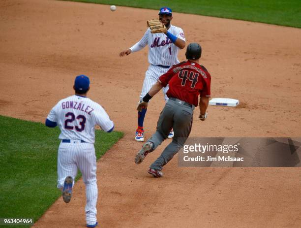 Paul Goldschmidt of the Arizona Diamondbacks in action against Amed Rosario and Adrian Gonzalez of the New York Mets at Citi Field on May 20, 2018 in...