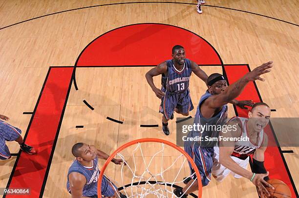 Jerryd Bayless of the Portland Trail Blazers goes up for a shot against Ronald Murray of the Charlotte Bobcats during a game on February 1, 2010 at...