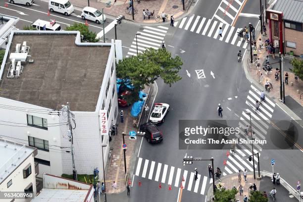 In this aerial image, a vehicle that had veered onto the sidewalk after hitting four pedestrians on May 28, 2018 in Chigasaki, Kanagawa, Japan. A...