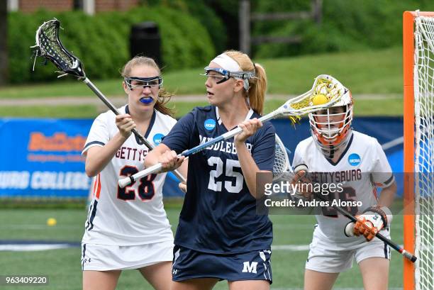 Middlebury College Panthers Kirsten Murphy gets defended at the goal by Gettysburg College Bullets Brooke Holechek and goalie Gettysburg College...