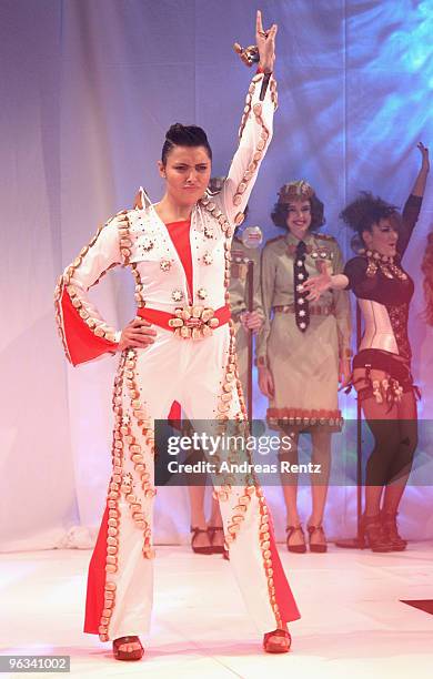 Actress Sophia Thomalla, dressed as Elvis Presley, runs down the runway during the Lambertz Monday Night Schoko & Fashion party at the Alten...