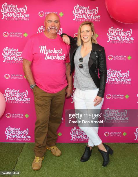 Merv Hughes and Ellyse Perry pose during the launch of Misterhood for the Sisterhood campaign on May 29, 2018 in Sydney, Australia.