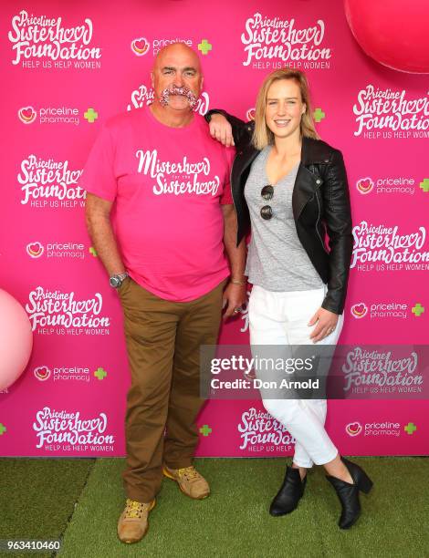 Merv Hughes and Ellyse Perry pose during the launch of Misterhood for the Sisterhood campaign on May 29, 2018 in Sydney, Australia.